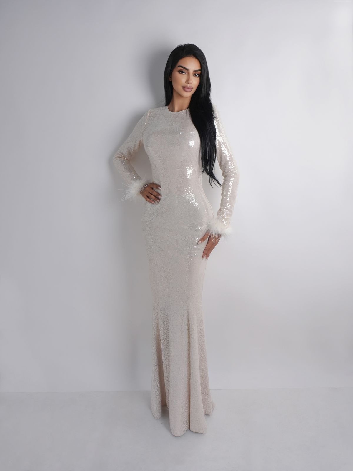 Casual yet professional studio portrait, balancing approachability with a refined look